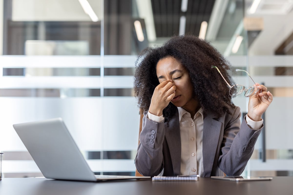 Tired woman dealing with menopause symptoms